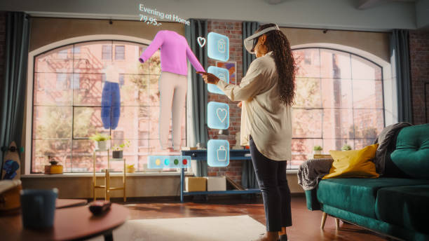 istock Black Woman Using Virtual Reality Headset for Online Shopping, Browsing through Stylish Clothing items. Ordering from Mock-up Internet Store App for e-Commerce products. Augmented Reality 2140486255