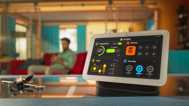 istock Creative Smart Home Device with Dark Theme Infographics Shown on Display and Icons With Functions. Person using Smartphone to Control His stylish House. IOT Connected Wireless Intelligent System 2140490383