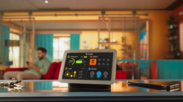 istock Creative Smart Home Device with Dark Theme Infographics Shown on Display And Icons With With Various Functions. Person using Smartphone to Control His House. IOT Connected Wireless Intelligent System 2140490996