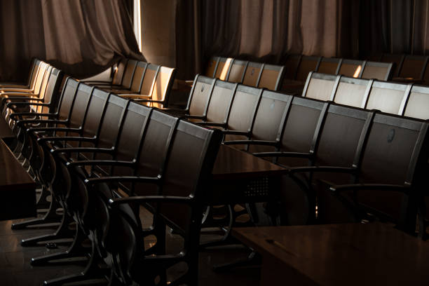 istock Rows of black chairs in an auditorium facing the front at Wuhan University 2140492076