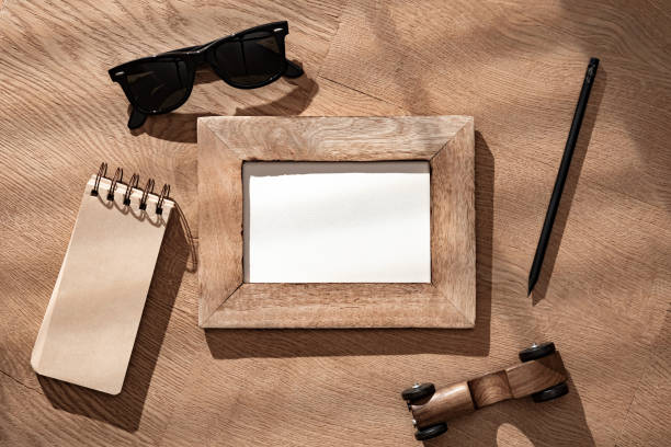 istock Wooden Frame and Men's Things Arranged on a Textured Desk Surface 2140506126