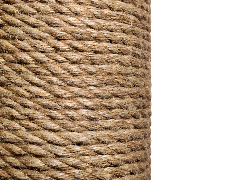 Jute rope in a skein close-up on a white isolated background. Natural organic threads. Environmentally friendly Material for creativity. Made from the Corchorus capsularis plant.
