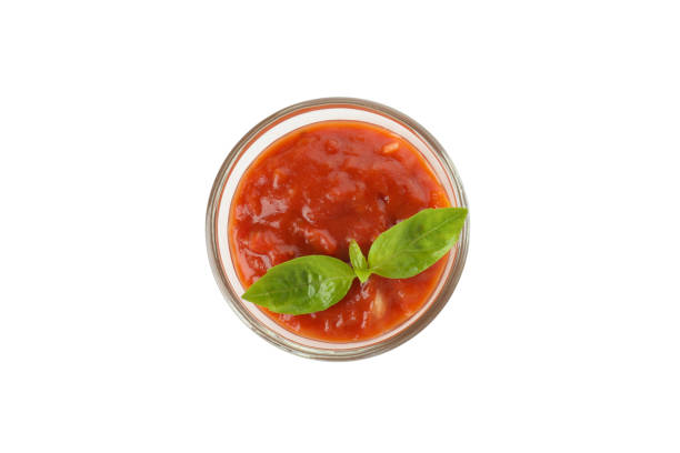 istock Adjika with basil leaves isolated on white background 2140520930