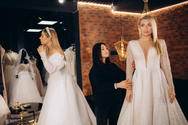 istock Two beautiful brides in a wedding salon 2140523574