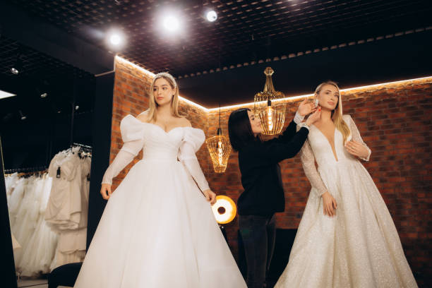 istock Two beautiful brides in a wedding salon 2140523576