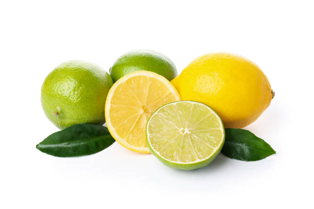 istock Lemons and limes with leaves isolated on white background 2140557964