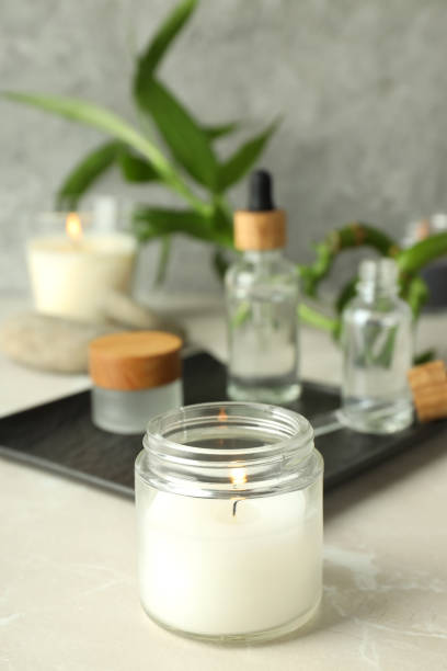 istock Concept of relaxation with aroma candles on light textured table 2140573699