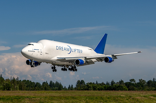 Everett, WA - June 23, 2023: The Boeing Dreamlifter, officially the 747-400 Large Cargo Freighter (LCF), is a wide-body cargo aircraft modified extensively from the Boeing 747-400 airliner. With a volume of 65,000 cubic feet it can hold three times that of a 747-400F freighter. The outsized aircraft was designed to transport Boeing 787 Dreamliner parts between Italy, Japan, and the U.S., but has also flown medical supplies during the COVID-19 pandemic.