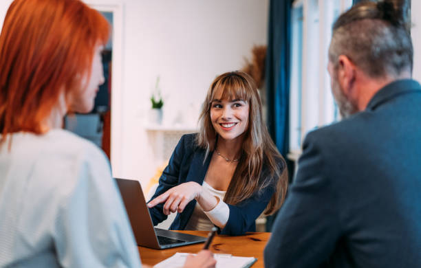 istock Group of business persons talking in the office. 2140577426