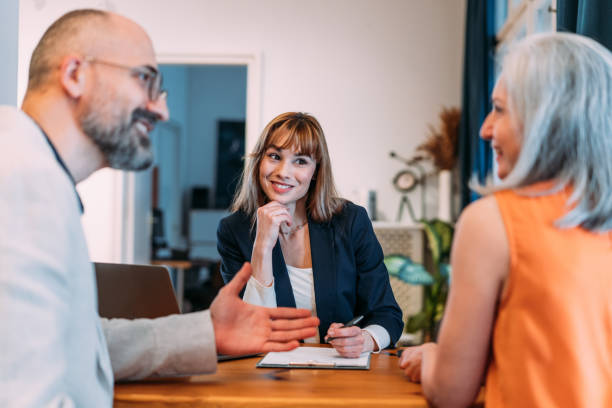 istock Group of business persons talking in the office. 2140577943