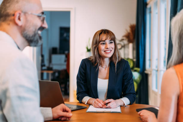 istock Group of business persons talking in the office. 2140577948