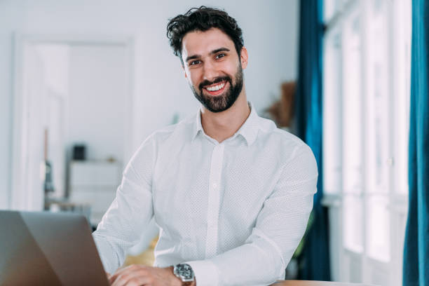 istock Successful businessman in modern office working on laptop. 2140578547