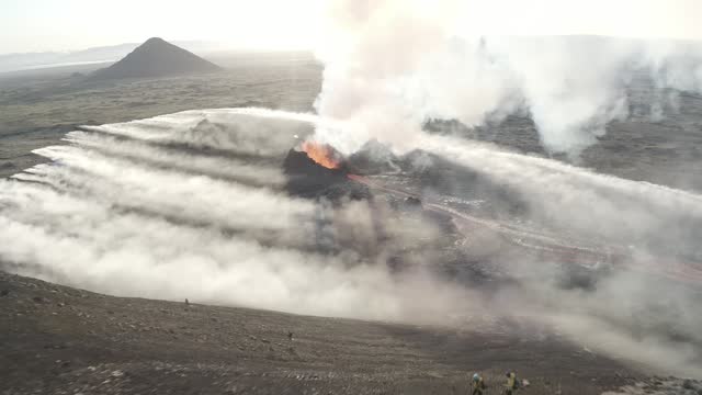 Aerial video of a volcanic eruption, lava and rivers, Litli Harut, Iceland