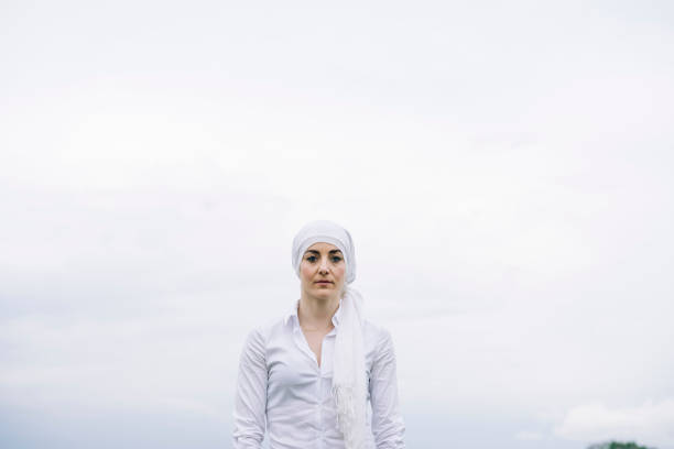 woman with white headscarf, has cancer