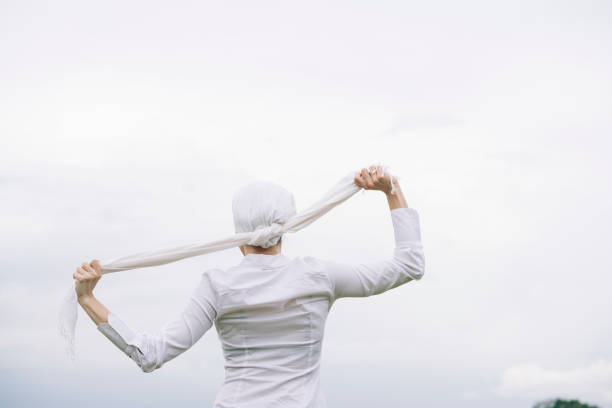 woman with white headscarf, has cancer
