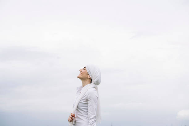 woman with white headscarf, has cancer