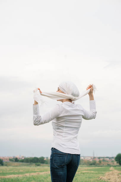 woman with white headscarf, has cancer
