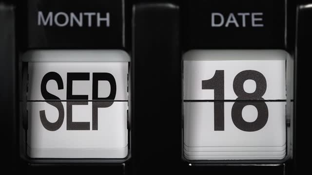 retro flip calendar with date change from seventeenth September to eighteenth September. close up.