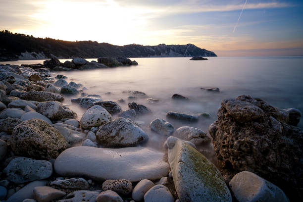 A low-down shot of the pebbled beach at Durdle Door, Jurassic coast, Dorset, south coast of England
