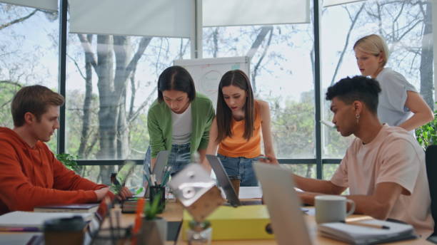 istock Young team creating ideas at office. Diverse colleagues brainstorming together 2140626527