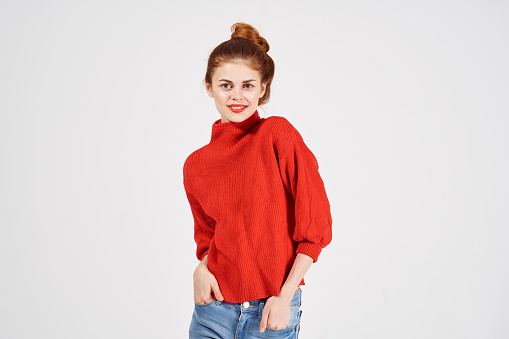 woman in red sweater gesturing with hands Copy Space. High quality photo