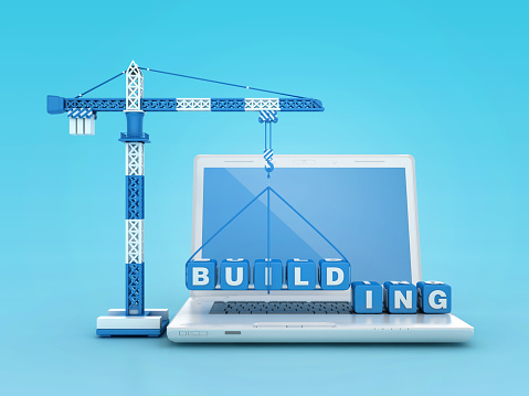 BUILDING Blocks with Tower Crane on Computer Laptop - Color Background - 3D Rendering
