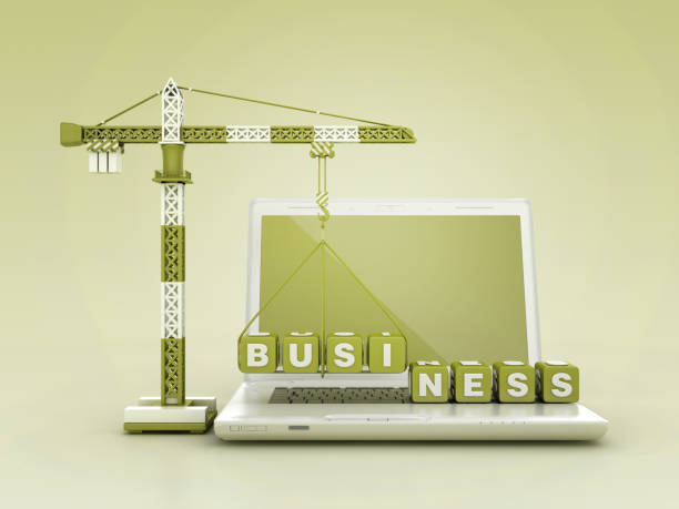 istock BUSINESS Blocks with Tower Crane on Computer Laptop 2140632465