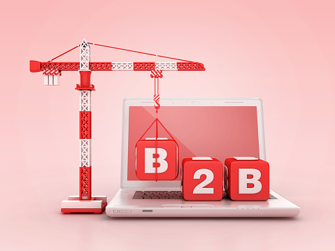 B2B Blocks with Tower Crane on Computer Laptop - Color Background - 3D Rendering