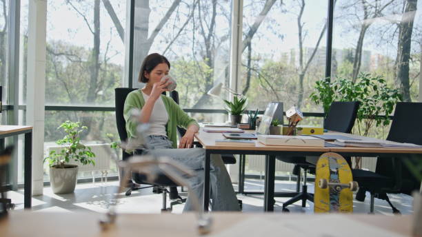 istock Business lady enjoy break holding cup beverage coworking. Office manager resting 2140654118