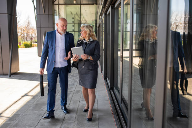 istock Business persons talking outside their workplace 2140654648