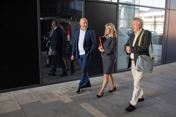 istock Business professionals talking to each other on their way to work 2140659458