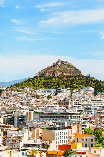 Athens, Greece - March 6 2022: Panorama of the Athens' skyline with the Lycabettus Mount. Photo taken from the Acropolis hill.