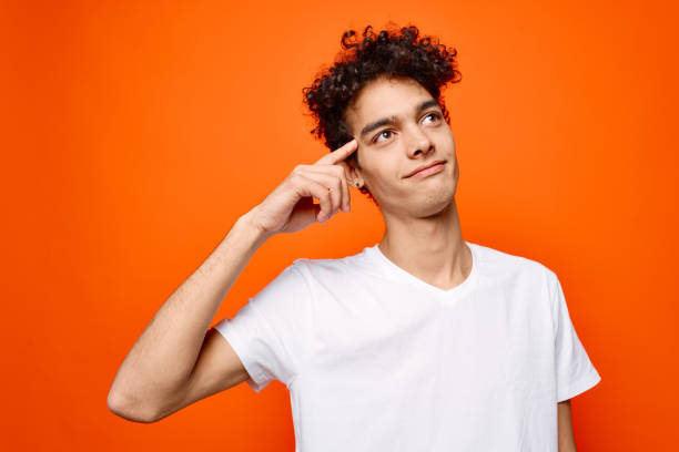 istock Cheerful guy in white t-shirt hand gesture emotions Studio 2140671499