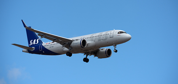 Tenerife, Spain March 31st, 2024. Airbus A320-251N SAS Airlines flies in the blue sky. Landing at Tenerife Airport