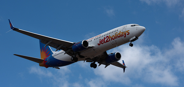 Tenerife, Spain March 31st, 2024. Boeing 737-8MG Jet2 Airlines flies in the blue sky. Landing at Tenerife Airport