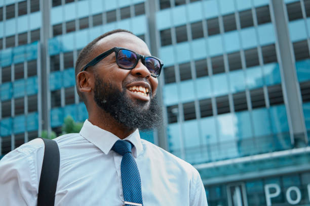 istock Professional Black Man in a Suit Outside Modern Office Building 2140692435