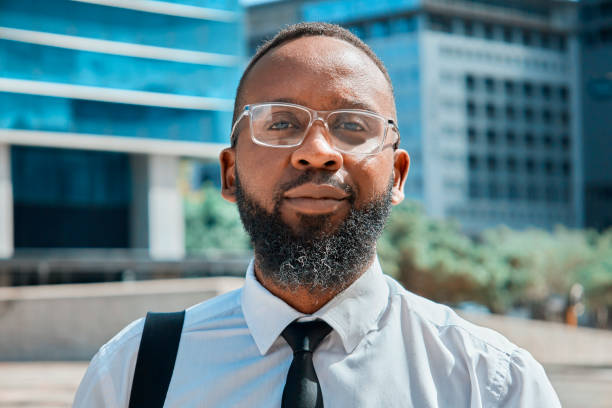 istock Confident Black Businessman in City Setting With Modern Architecture 2140692476