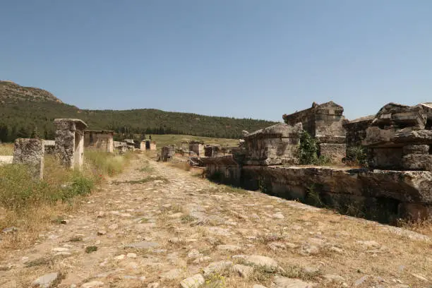 Photo of Main street leading through the Northern Necropolis at the ancient site of Hierapolis lined with sarcophagus sarcophagi and tombs, Pamukkale, Denizli, Turkey