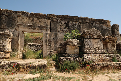 Several sarcophagus sarcophagi placed in front of a mausoleum at the northern Necropolis of the ancient site of Hierapolis, Pamukkale, Denizli, Turkey 2022