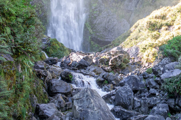 istock Devils Punchbowl waterfall cascades amid lush NZ greenery, a jewel of Arthur's Pass 2140750048
