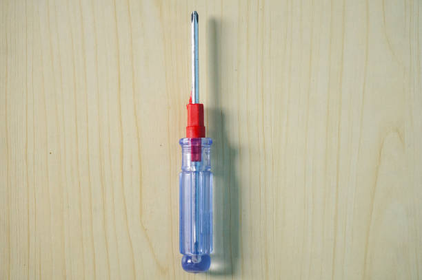 Screwdriver set on a wooden background top view