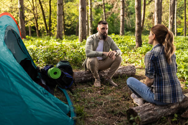 istock Beautiful Couple Enjoying Conversation by Tent 2140757517