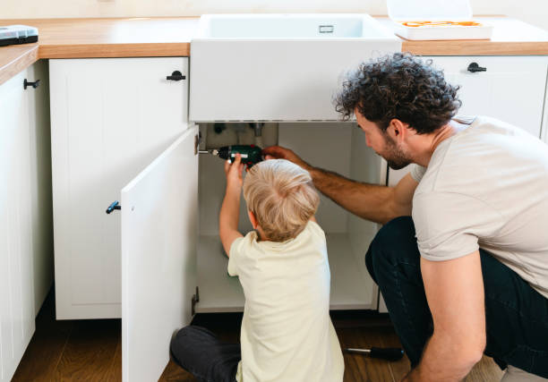 istock Father and son assembling kitchen furniture 2140778353