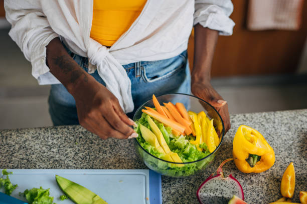 istock Woman making a fresh salad 2140791727