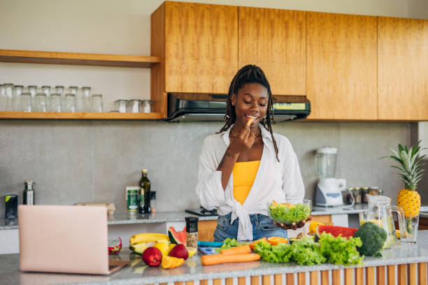 istock Woman eating a fresh salad 2140800342