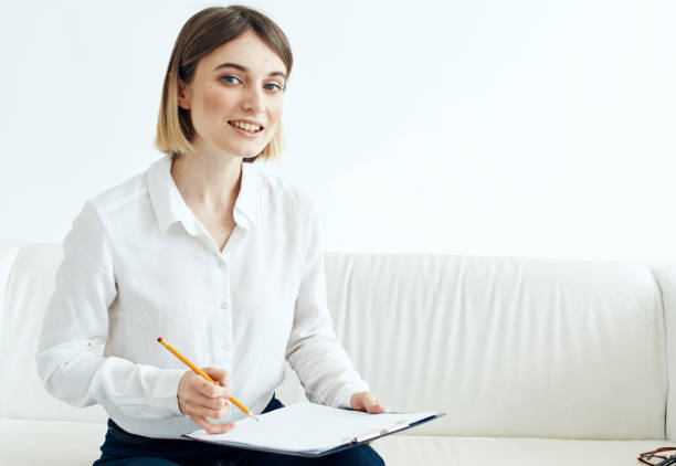 istock woman indoors in shirt with document folder in hands mockup 2140818583