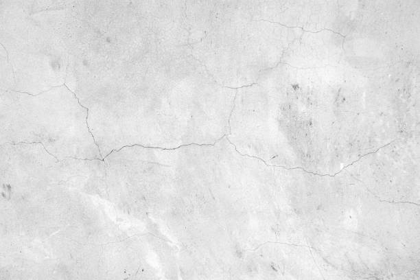 istock The surface of a cracked raw concrete wall background 2140819126