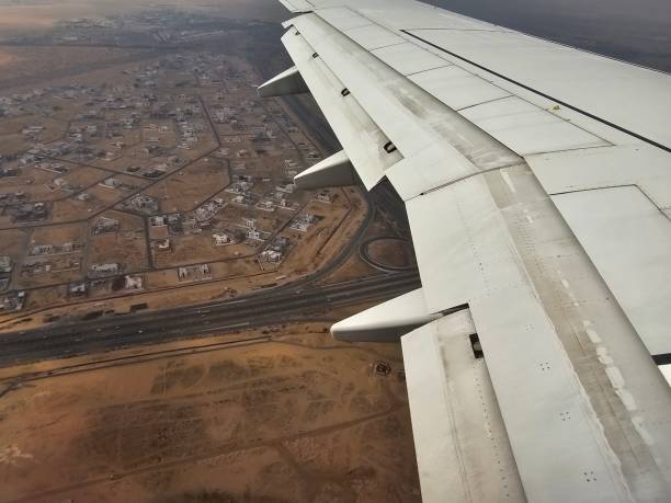 istock Airplane Wing Flying Over Rural Area 2140835388