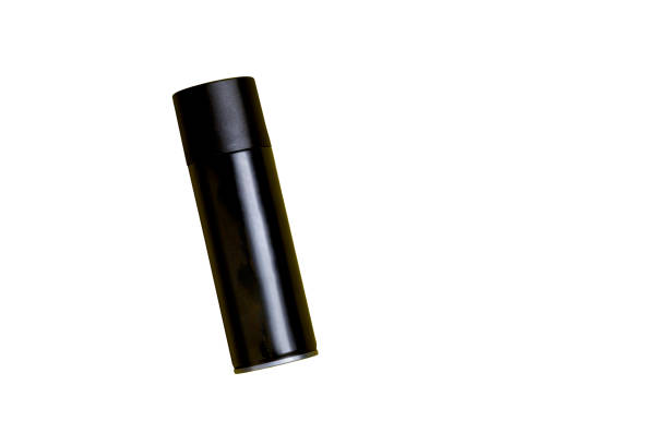 istock Black spray can isolated on yellow background 2140835920