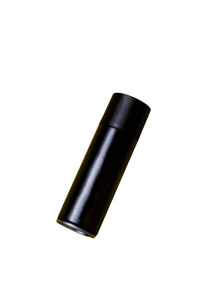 istock Black spray can isolated on yellow background 2140835930